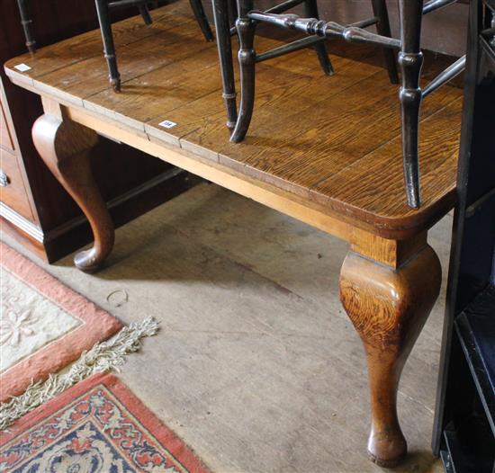 Oak dining table on cabriole legs